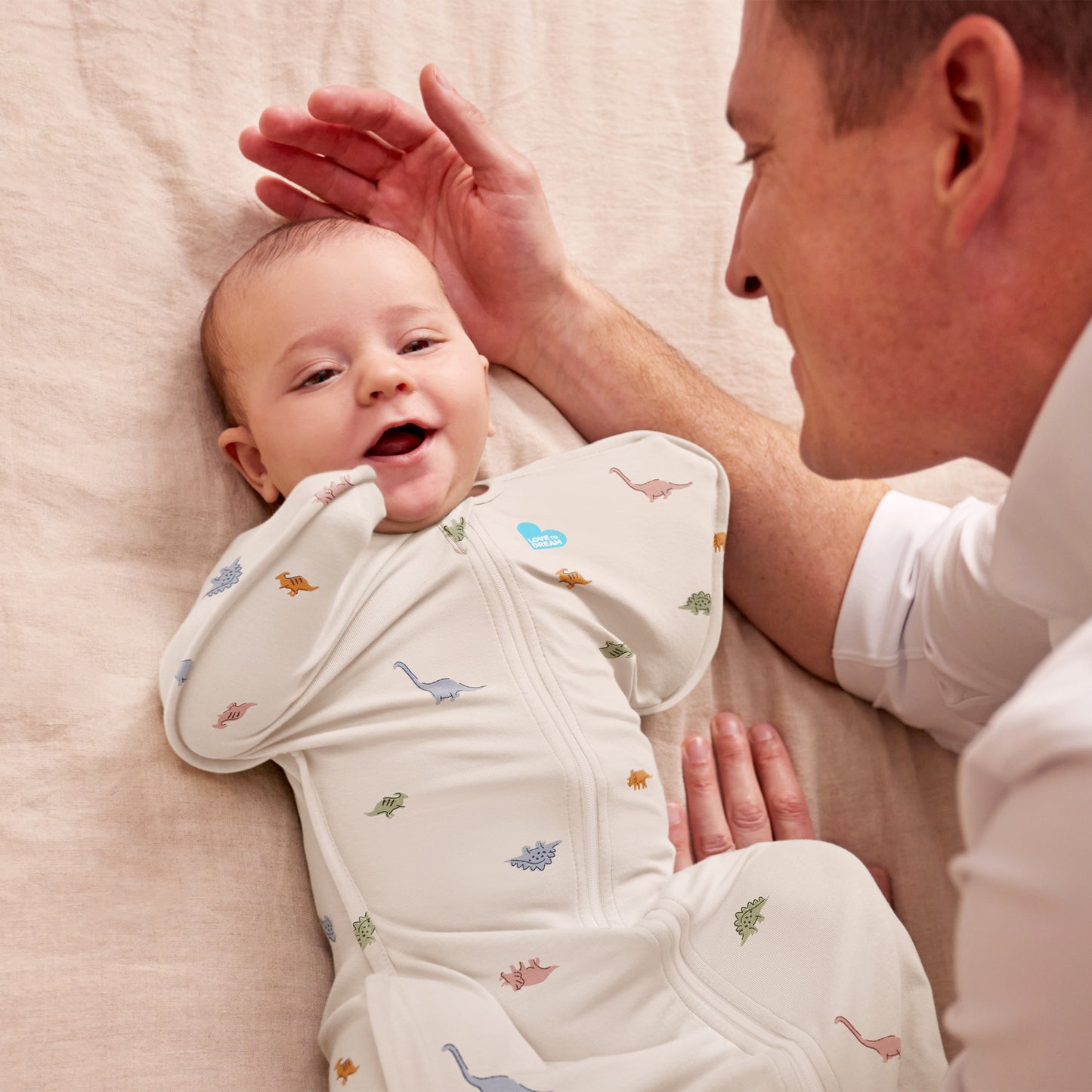 Swaddle Up™ 1.0 TOG Cotton Cream Dino Snore