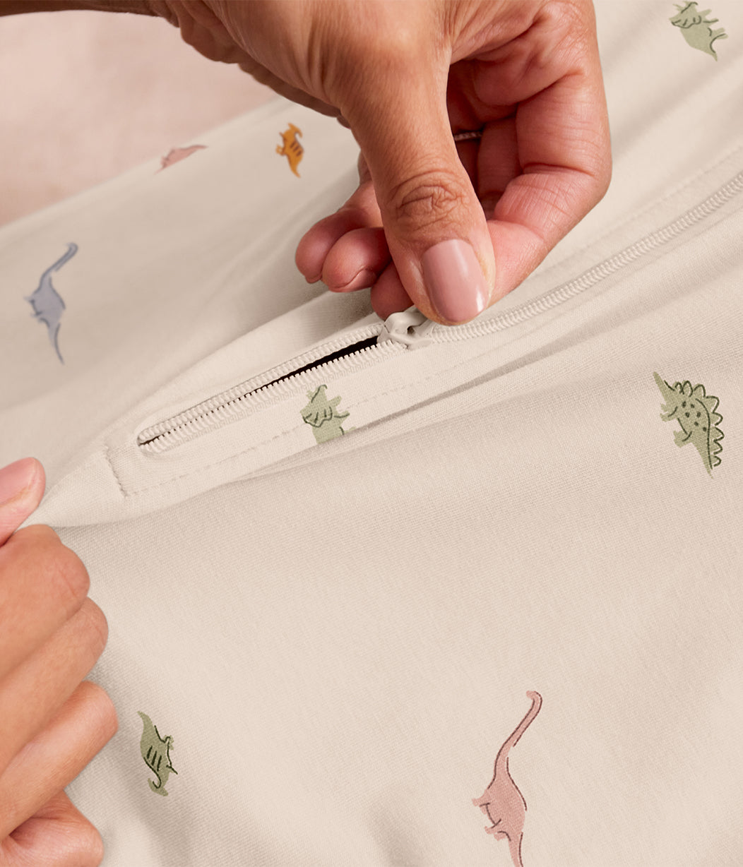 Swaddle Up™ 1.0 TOG Cotton Cream Dino Snore